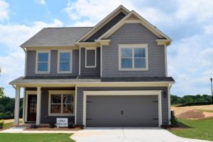 Image of a new home with Open House sign in front yard