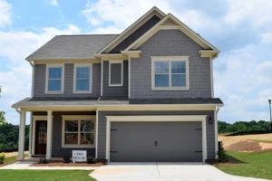 Image of a new home with Open House sign in front yard